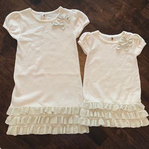 Matching Girls 100% cotton, cream sweater dress with bottom ruffles.